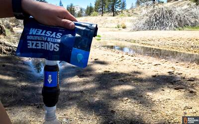 Sawyer-Squeeze-Water-Filter-review-filtering-with-rolled-up-bag