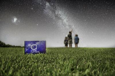 outdoor gear for kids subscription box in front, kids stargazing in back
