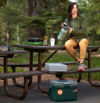 Camper sits on a picnic bench