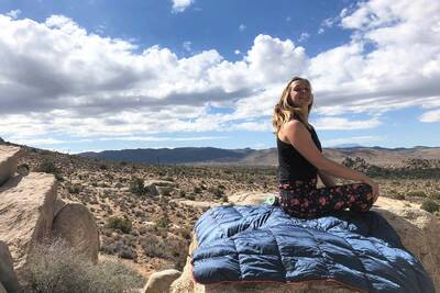 Rumpl-Down-Puffy-Blanket-review-on-rock-with-view-featured