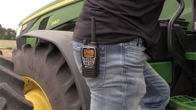 The Midland's GXT3000 clipped onto farmers trousers