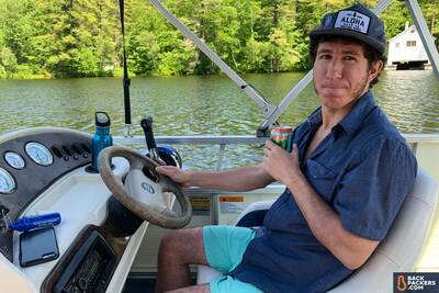 driving-boat-on-lake-in-maine