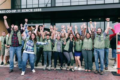 Happy employees excited to welcome guests to REI