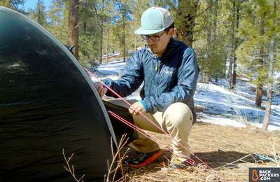 Rab Xenon X Technical Hoodie setting up tent