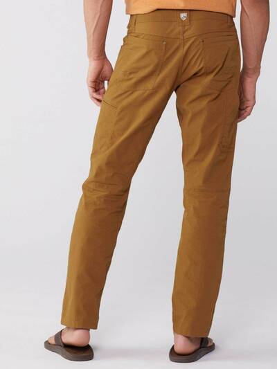 Backside of man wearing KUHL Radikl Pants in Teak